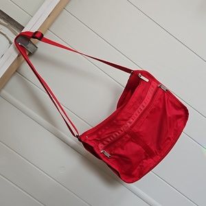 Classic LeSportsac shoulder bag in solid red.
